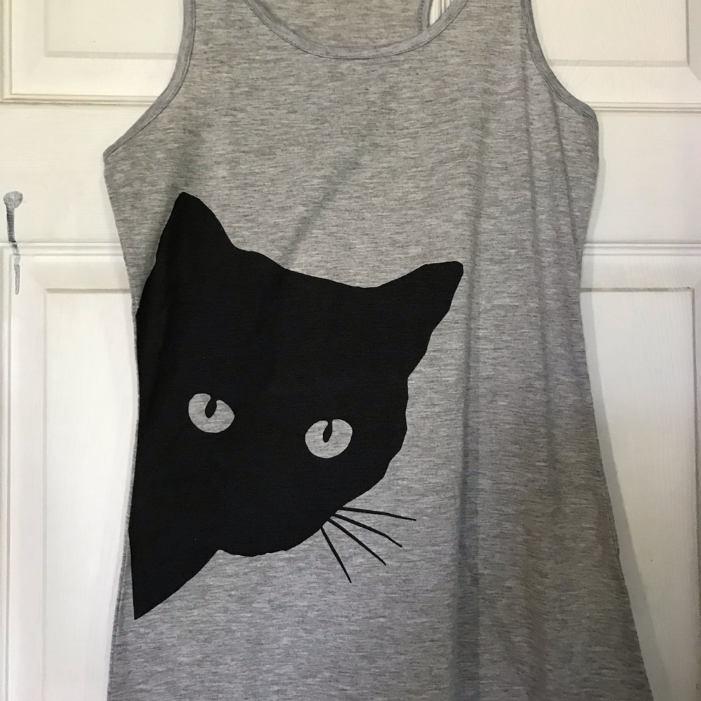 Black cat on gray tank